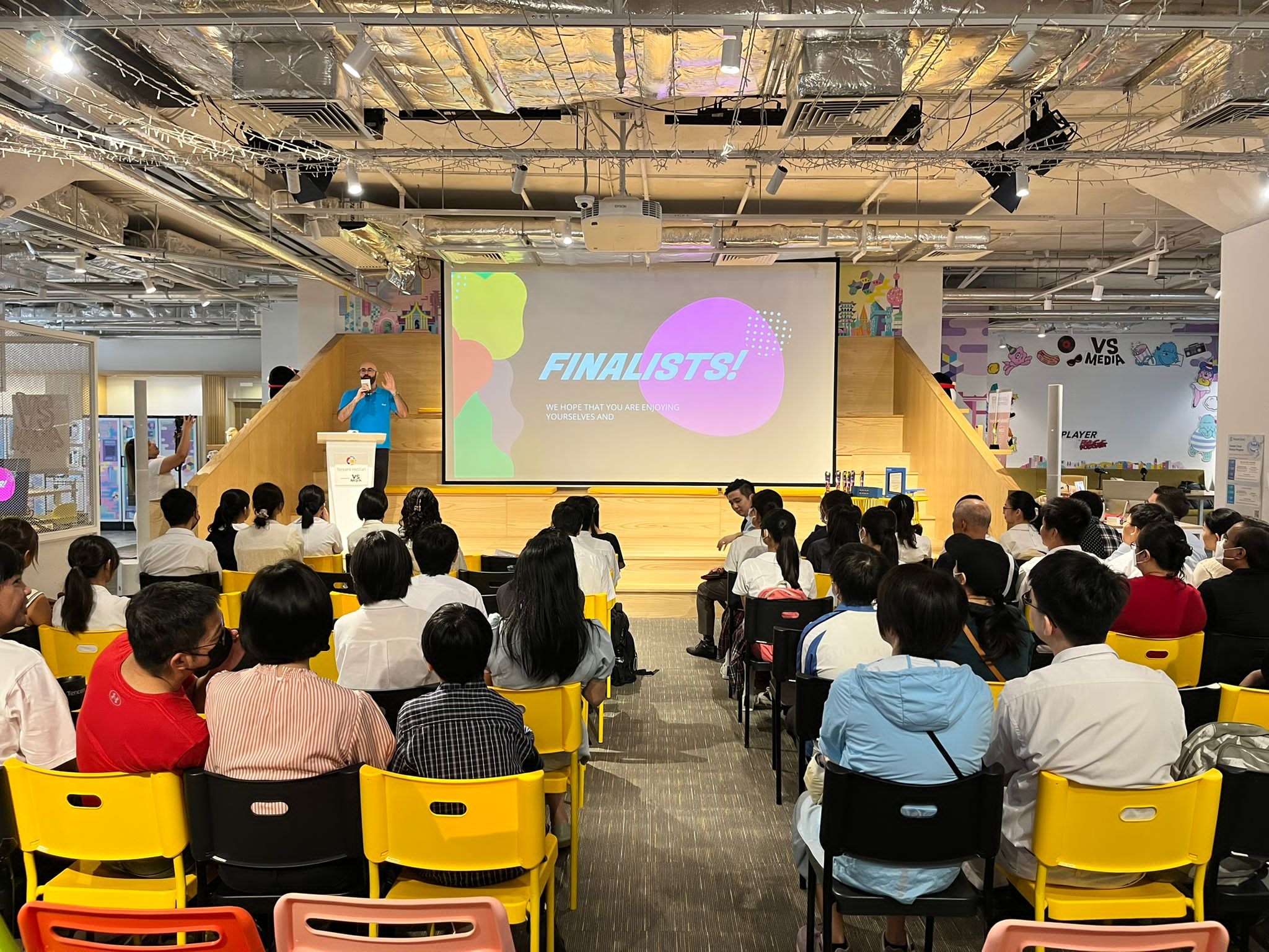 Audience watching finalists presentation