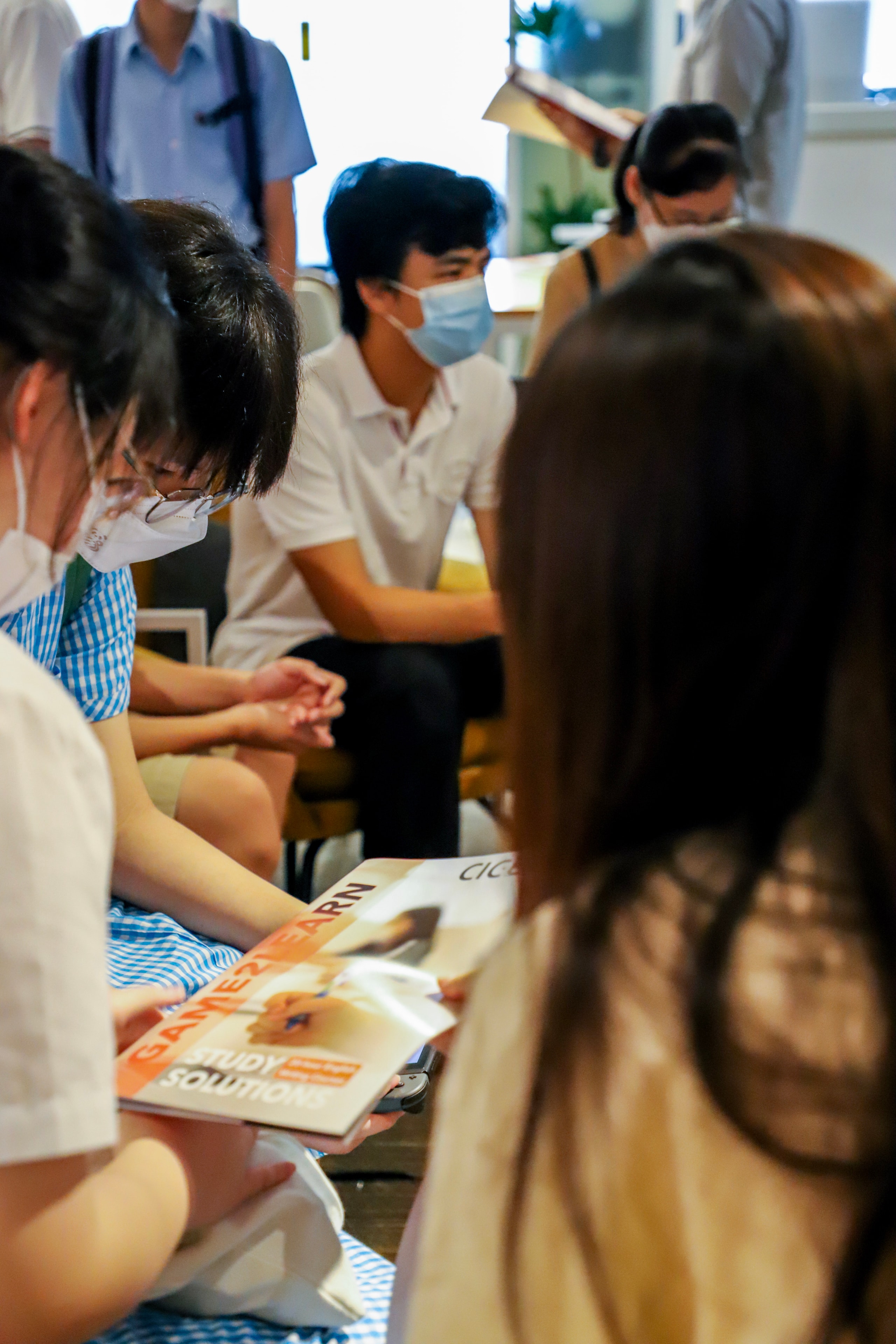Staff distributing materials to students at the 2022 event