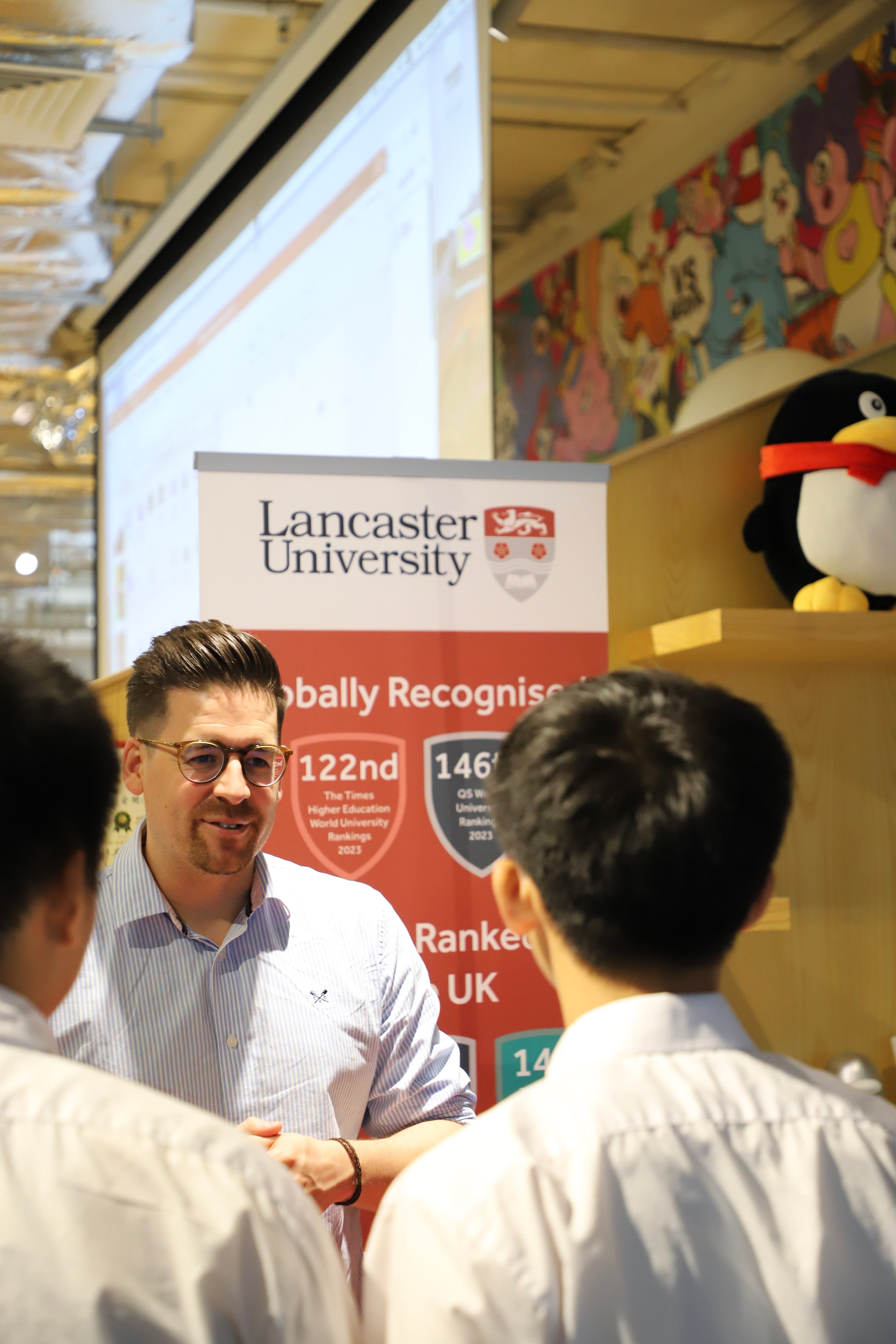 Man speaking with students at Lancaster University