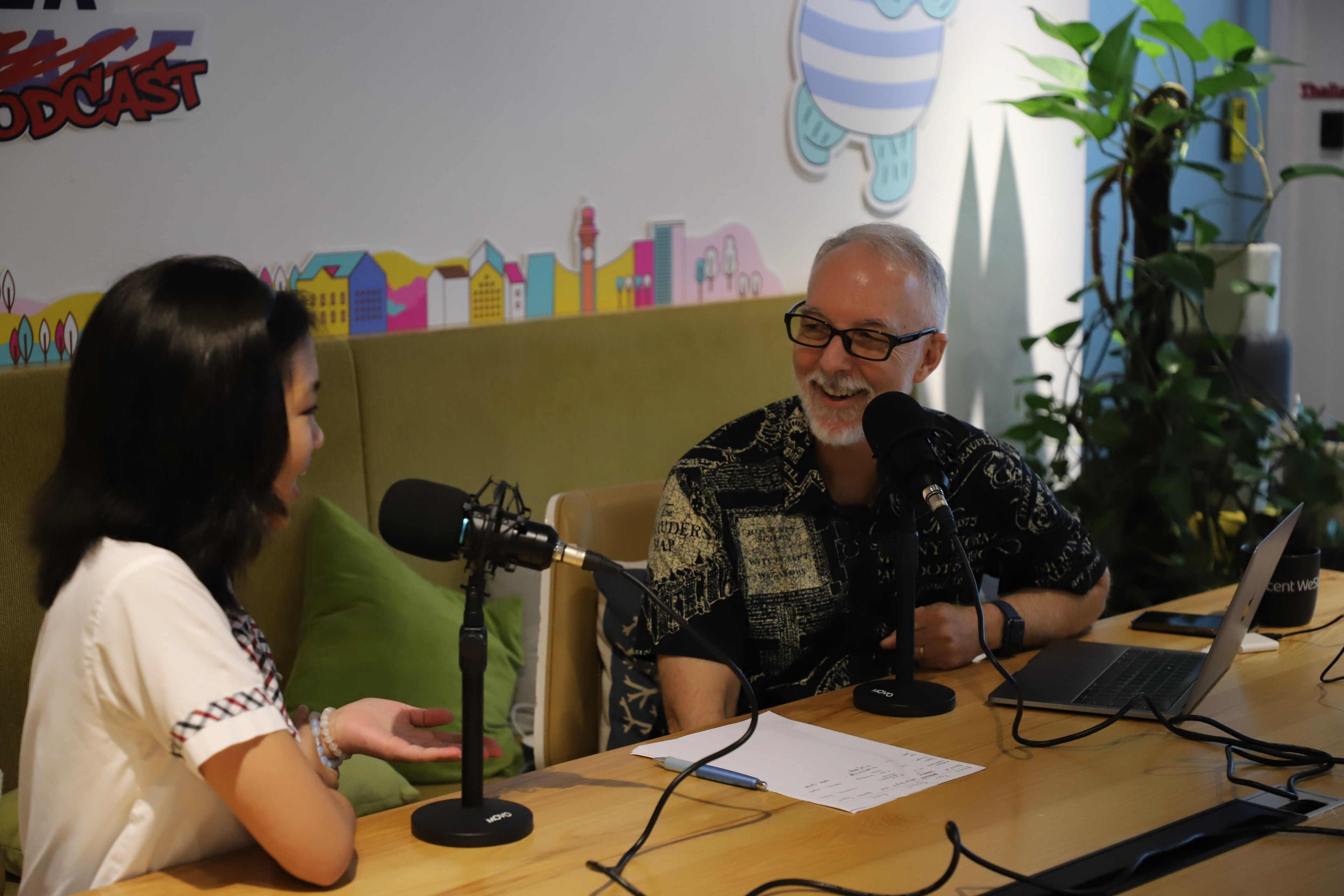 Two people recording the From Player to Podcast