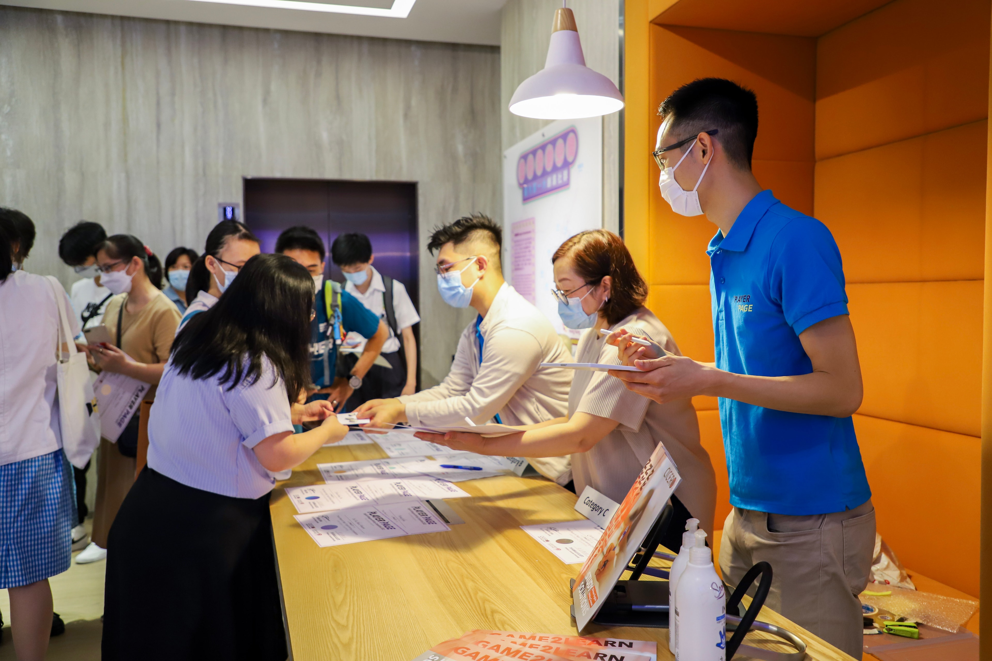 Staff at the event registration desk