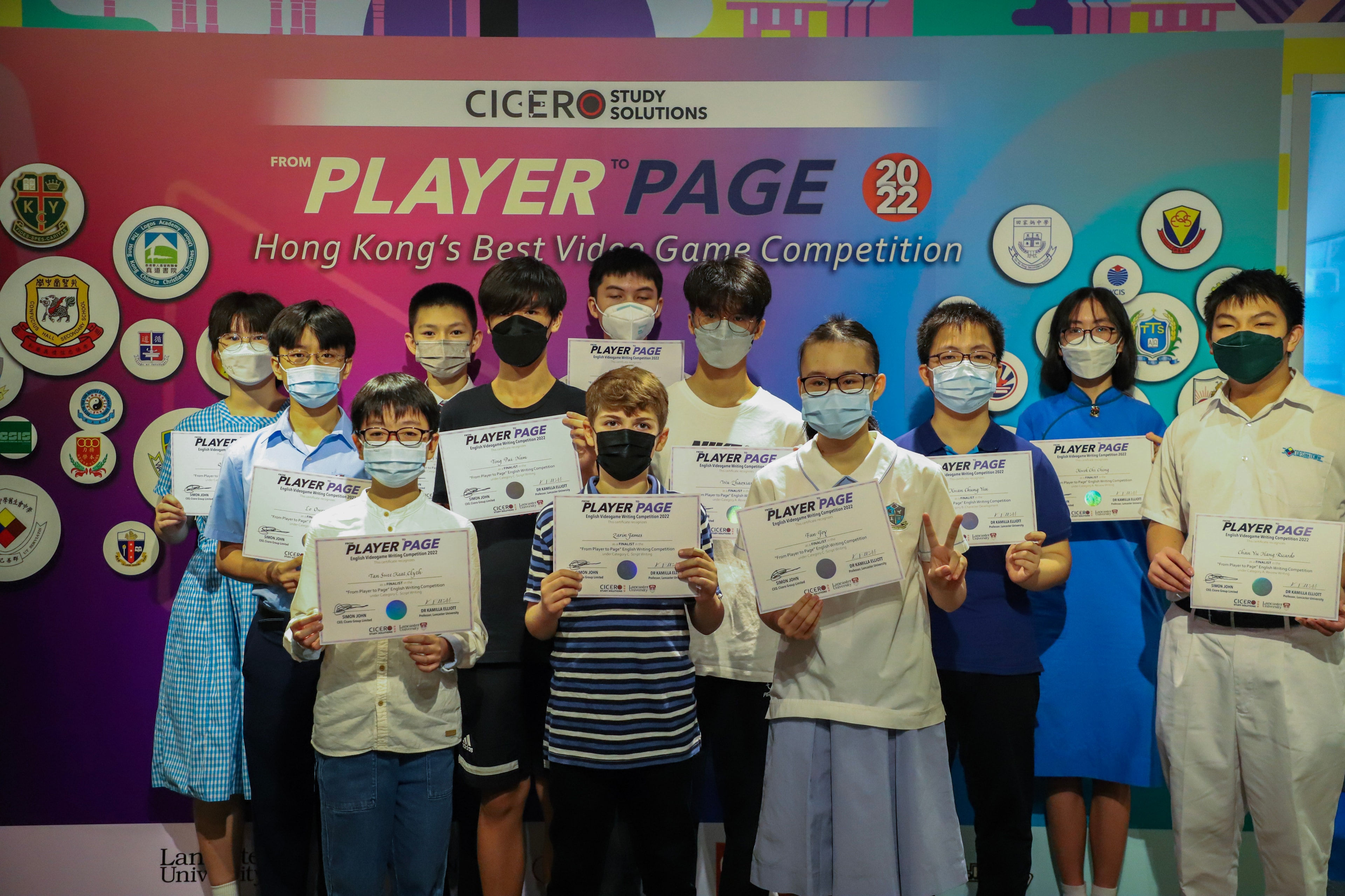 Students holding certificates at the competition