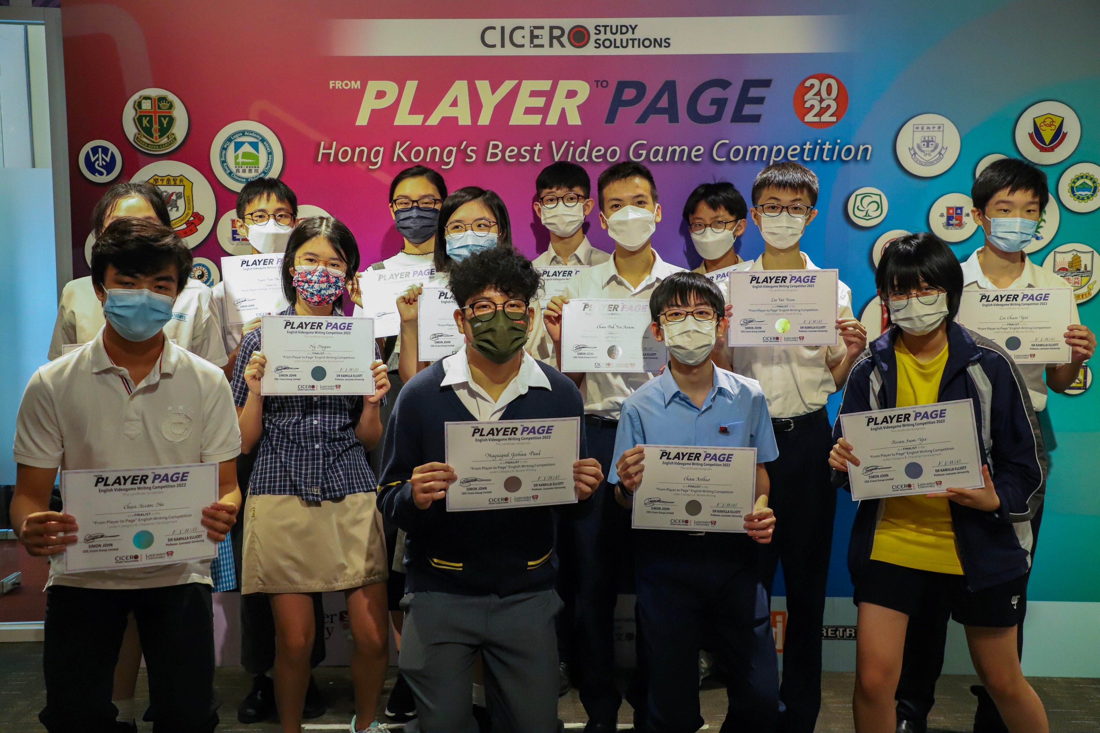 Students holding certificates at the video game competition