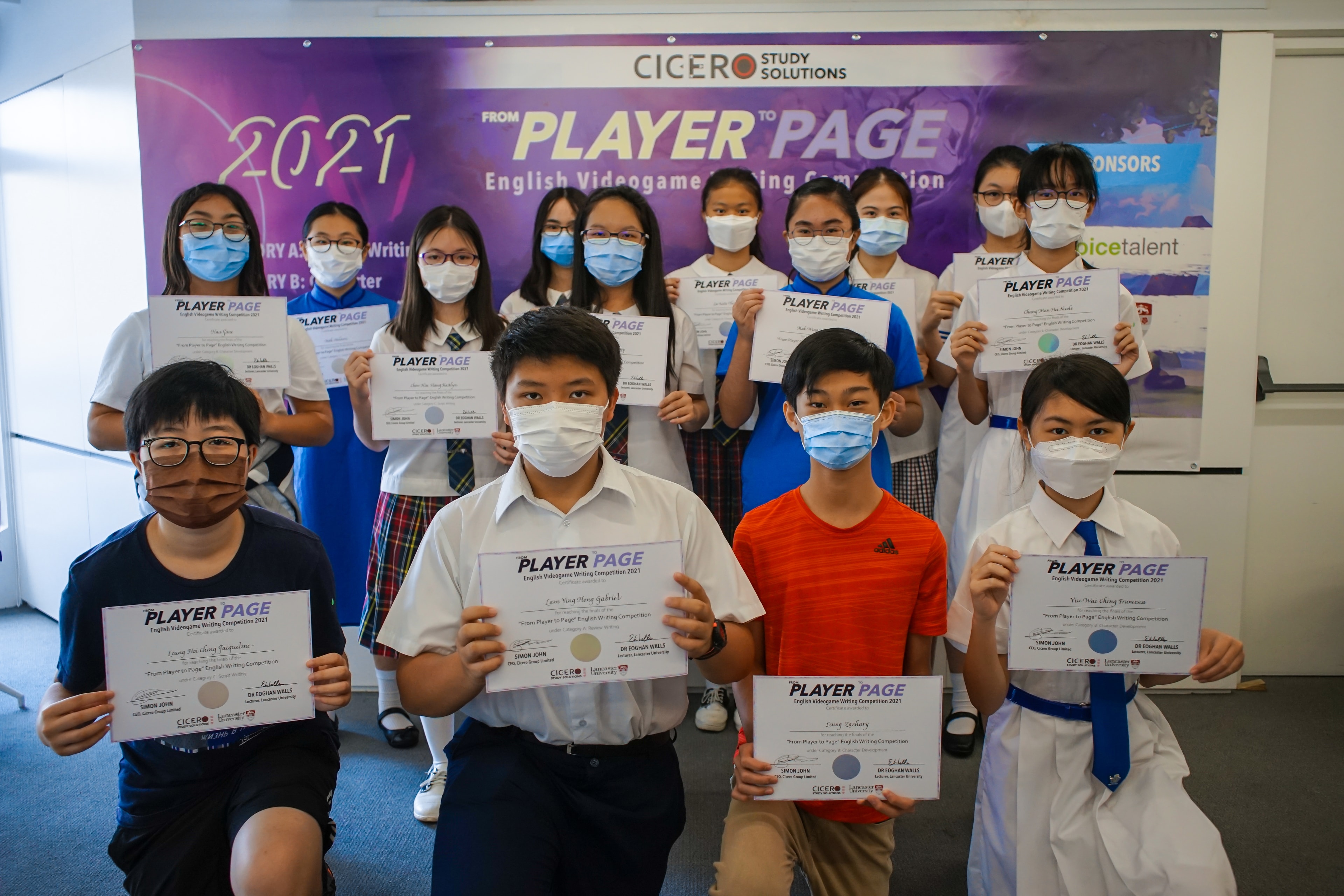 Students holding From Player to Page competition certificates