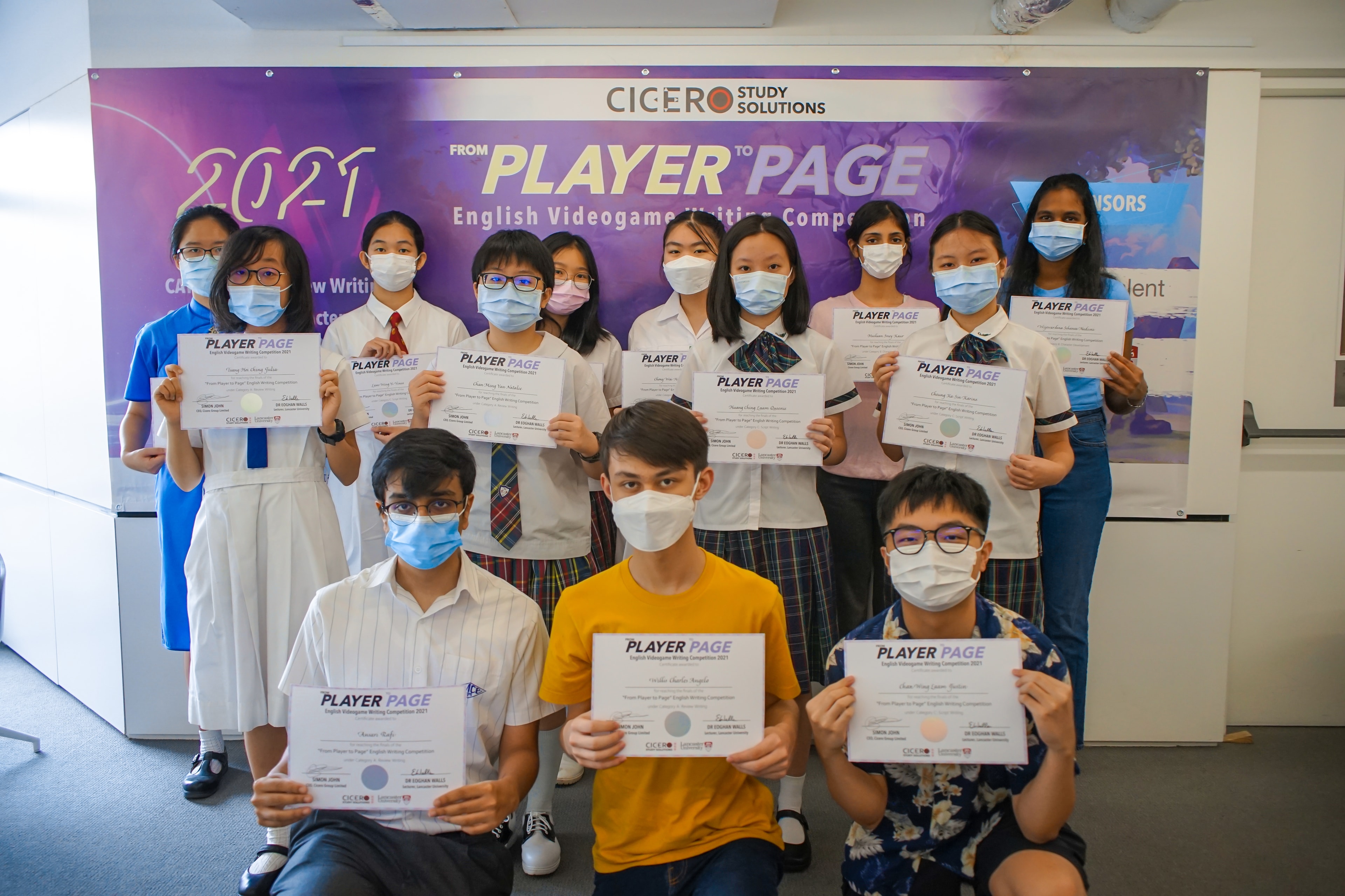 Students holding certificates at the inaugural competition