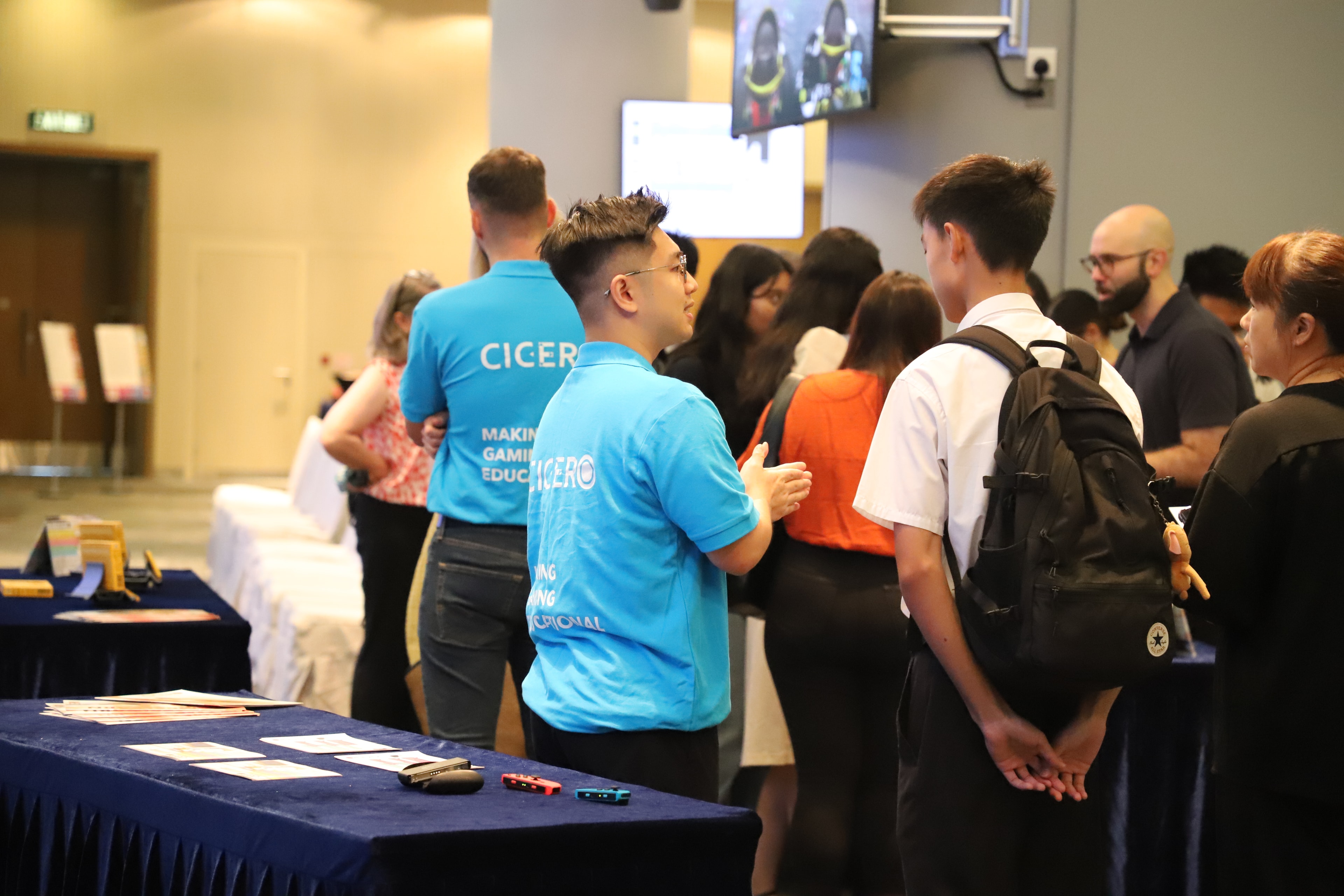 Event organiser presenting to the crowd at Cyberport