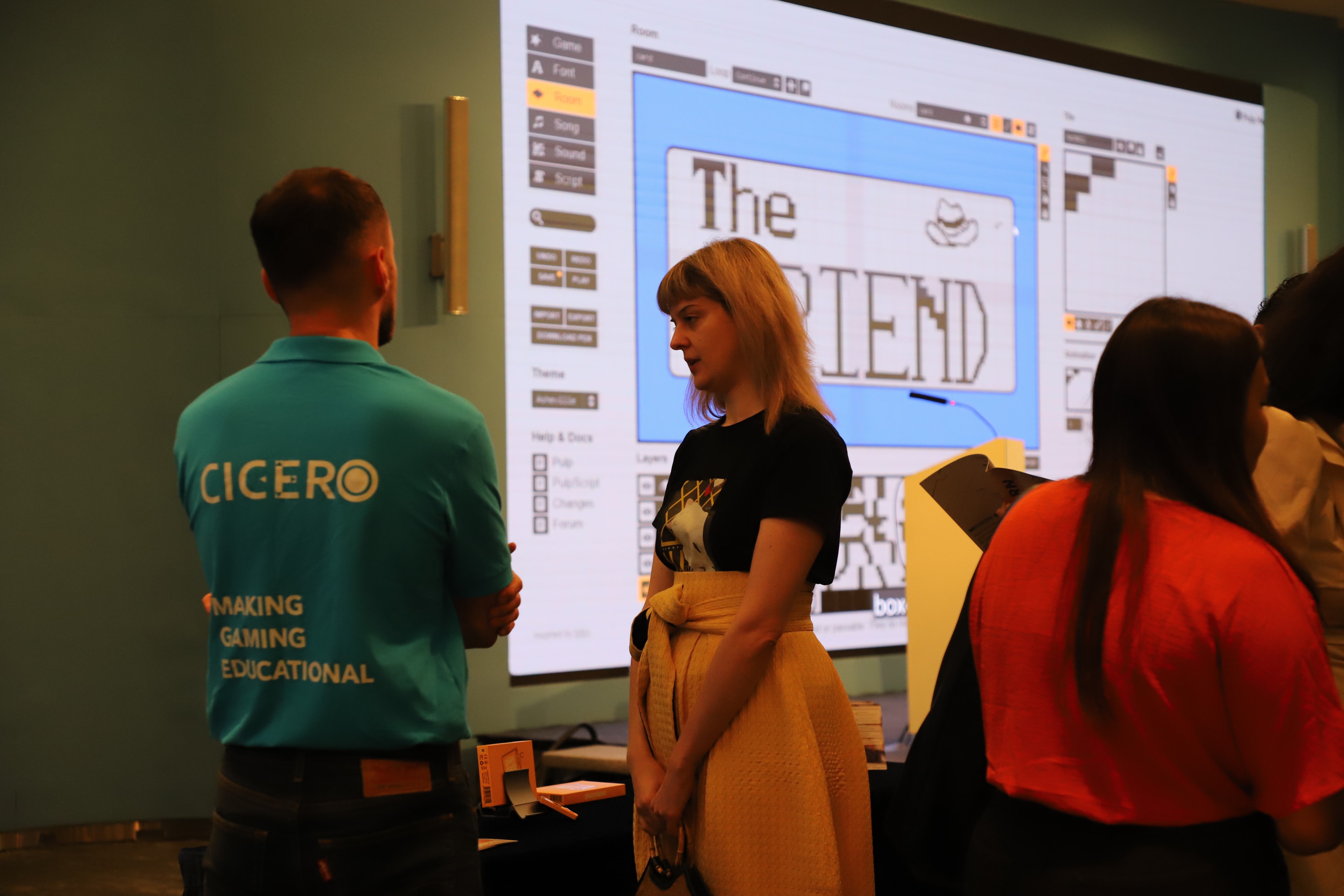 Attendees viewing game design presentation at Cyberport
