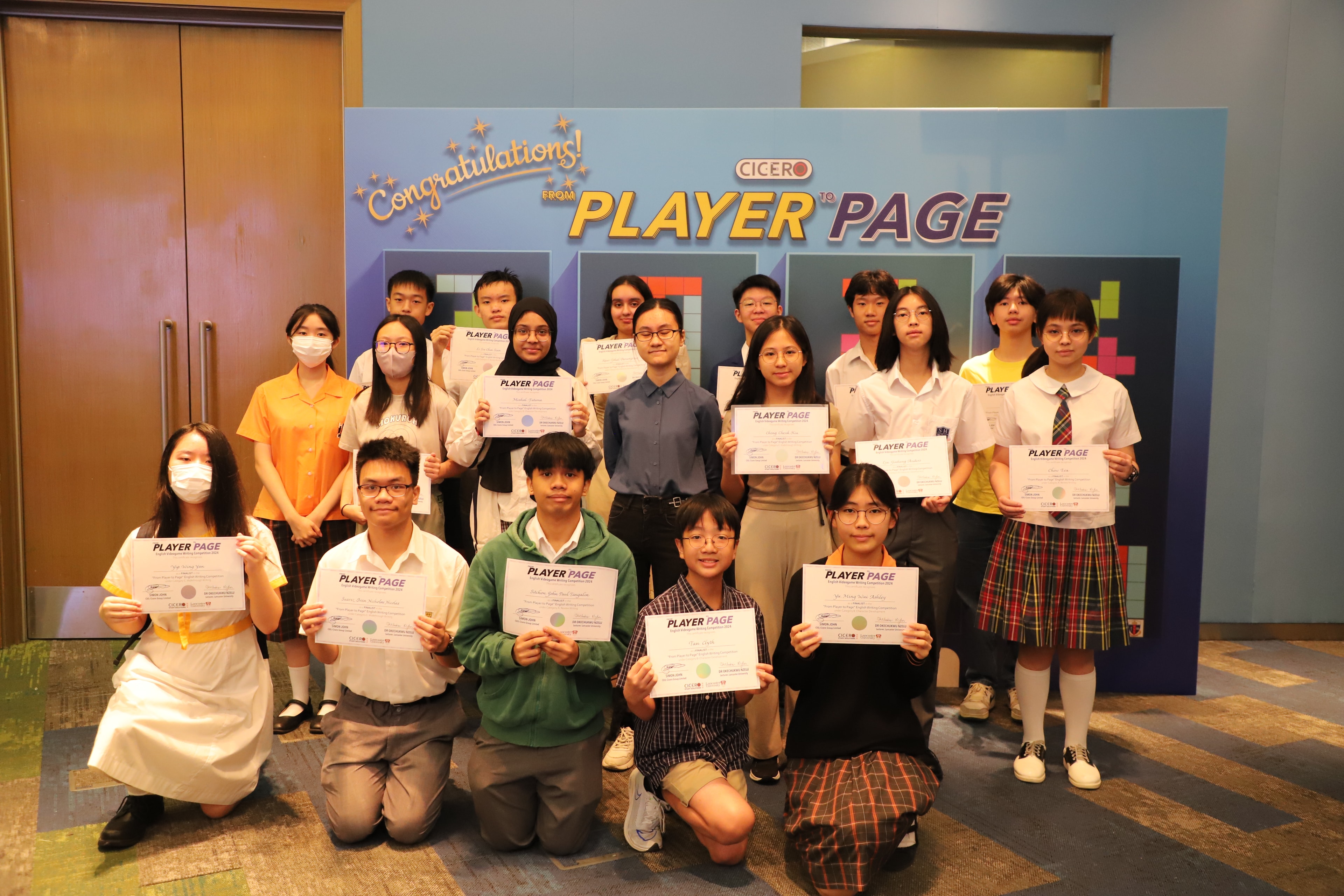 Group of students holding From Player to Page certificates