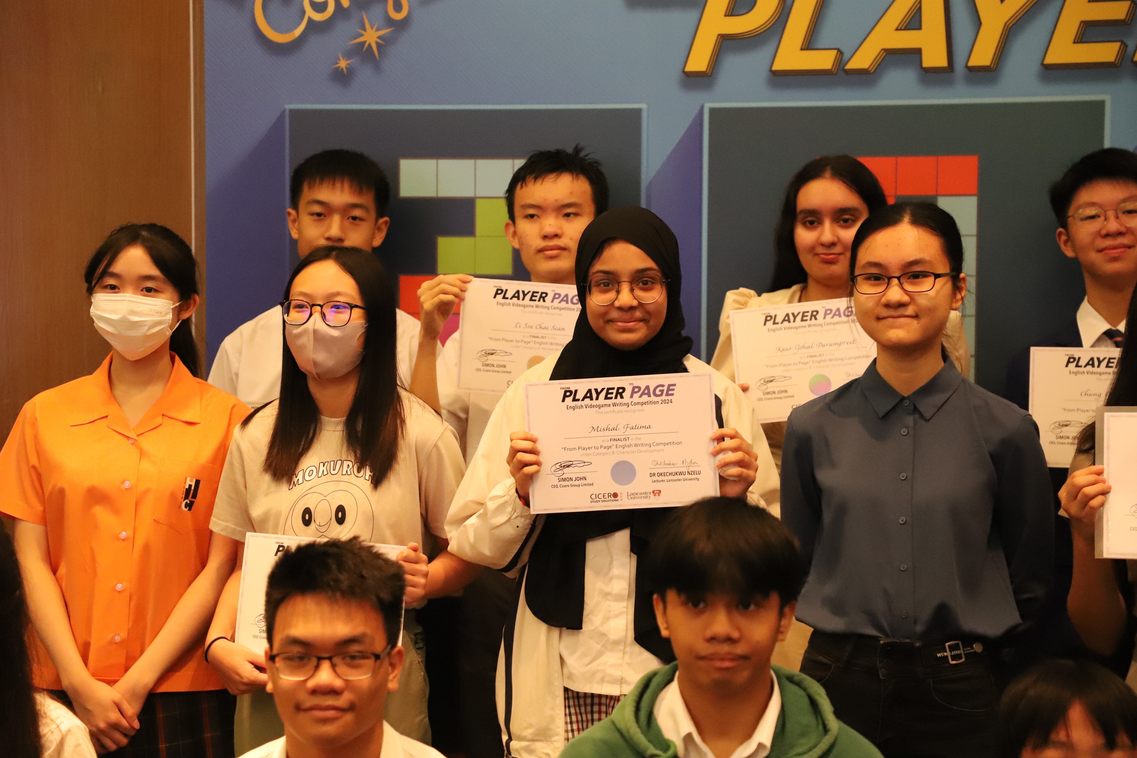 Students holding competition certificates at the awards